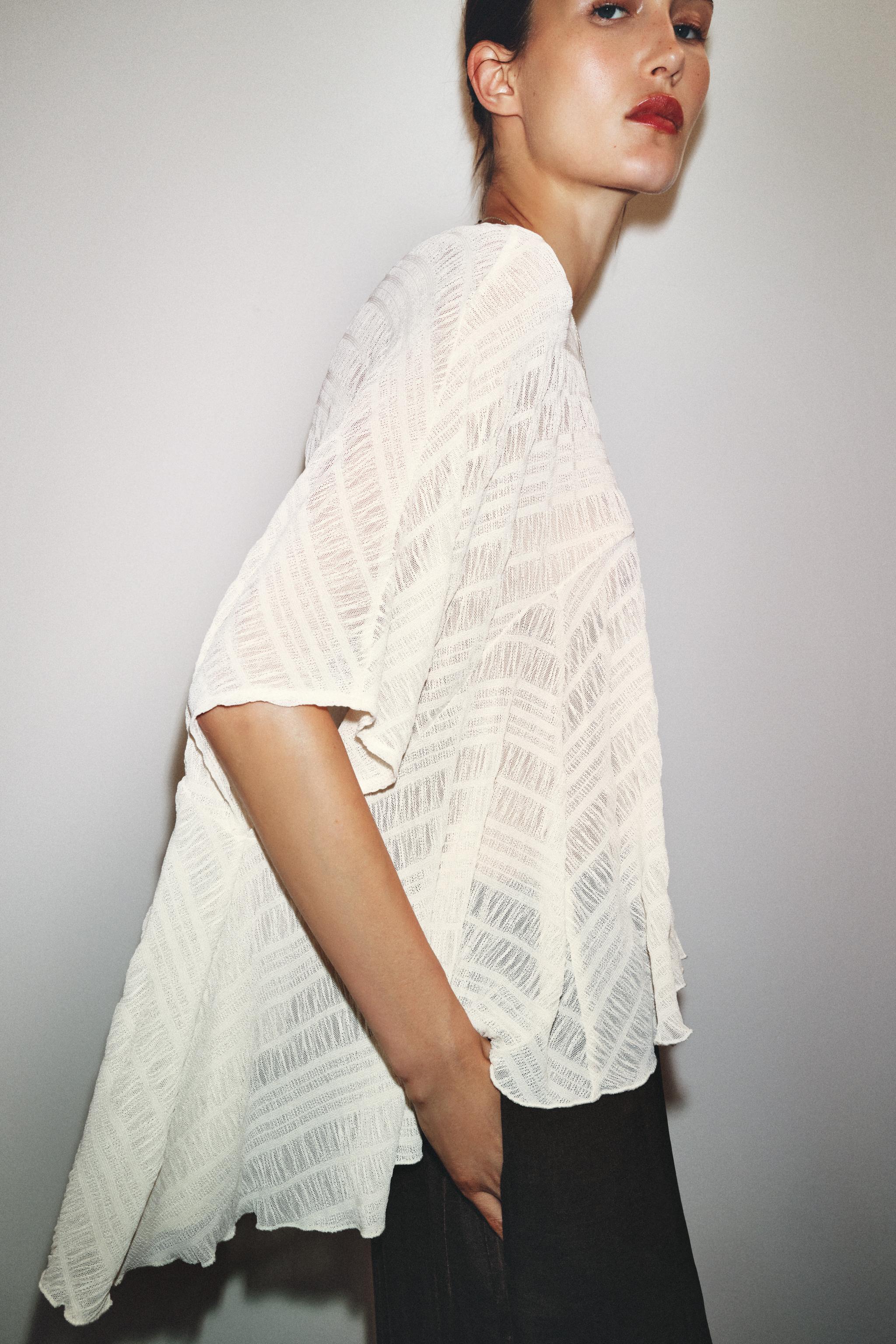 ASYMMETRIC TEXTURED CAPE BLOUSE